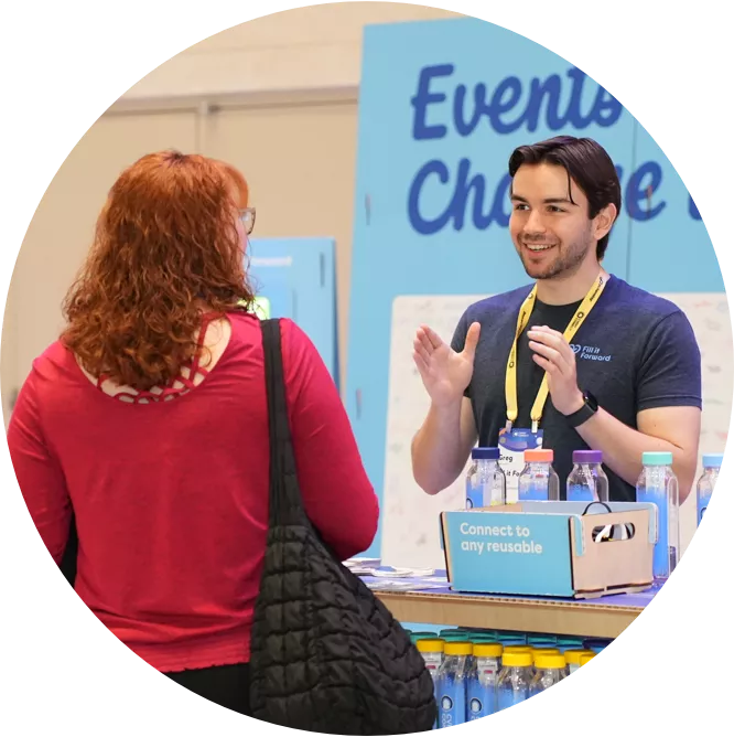 Man working booth at trade show