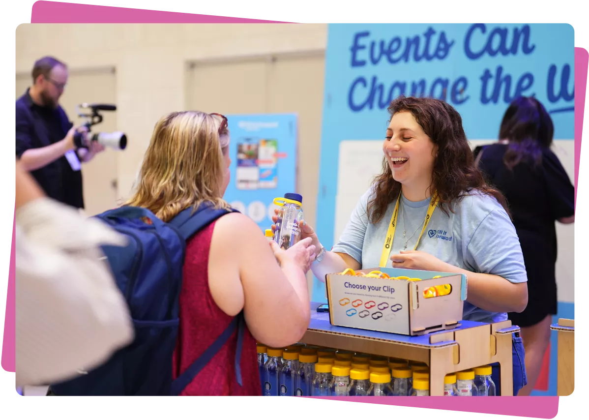 Woman smiling, gifting a cupanion water bottle