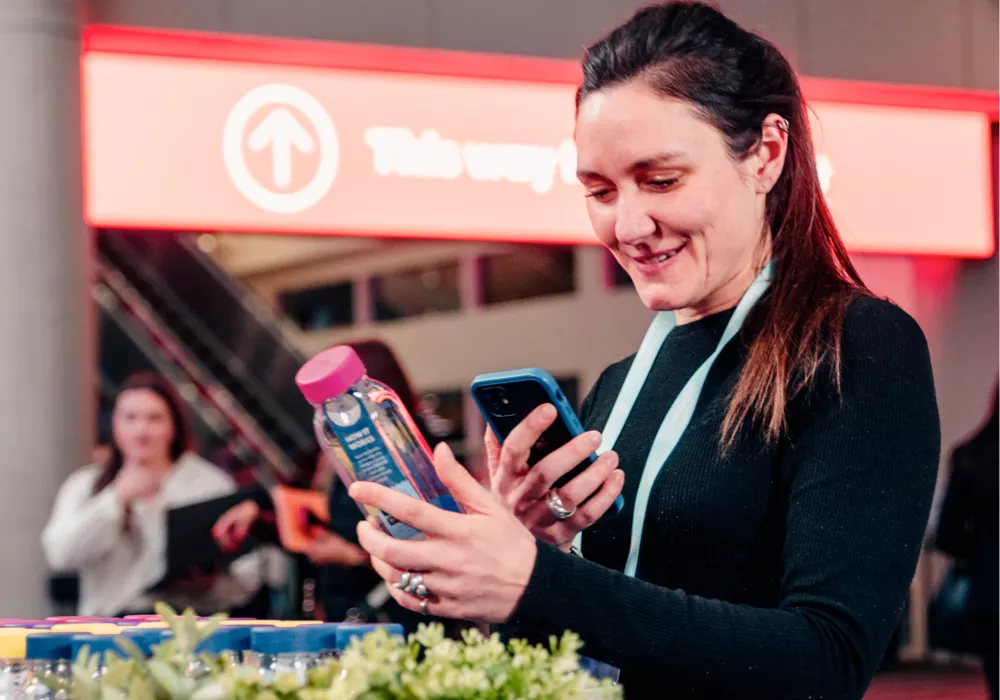 Women scanning her cupanion bottle to track her reuses