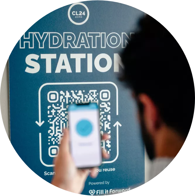 Man scanning QR code at hydration station
