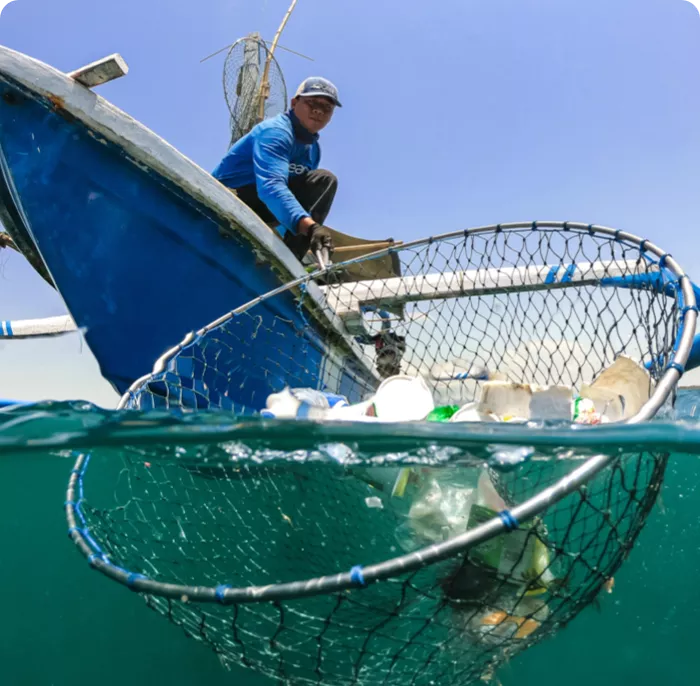 Man cleaning oceans of plastic and waste