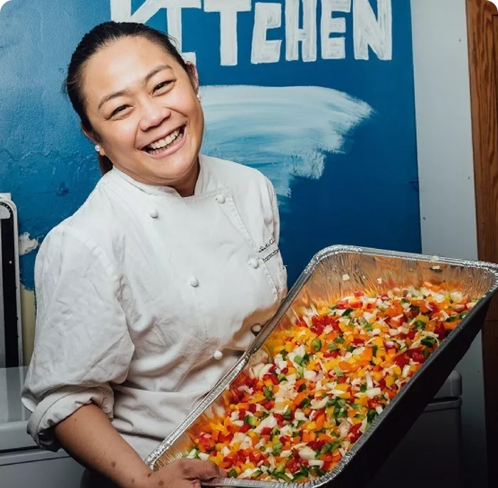 Woman holding a container of food